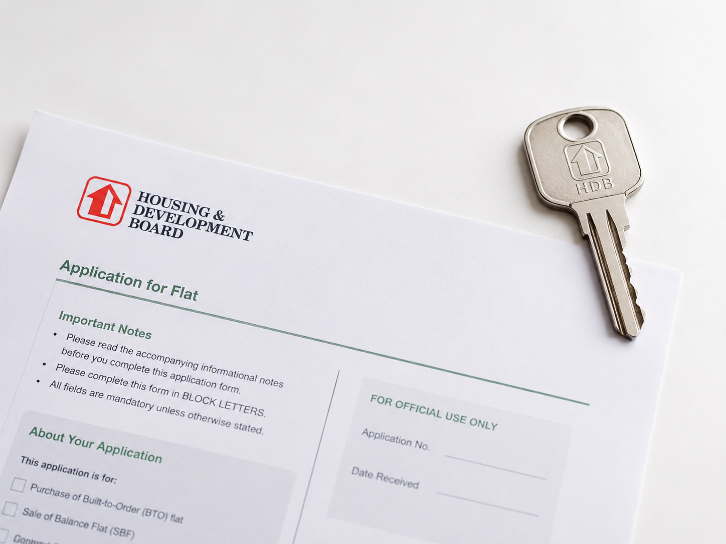 HDB key and document representing transfer of ownership after divorce in Singapore